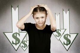 Stressed shocked woman with financial market chart graphic going down on grey office wall background. Poor economy concept. Face expression, emotion, reaction